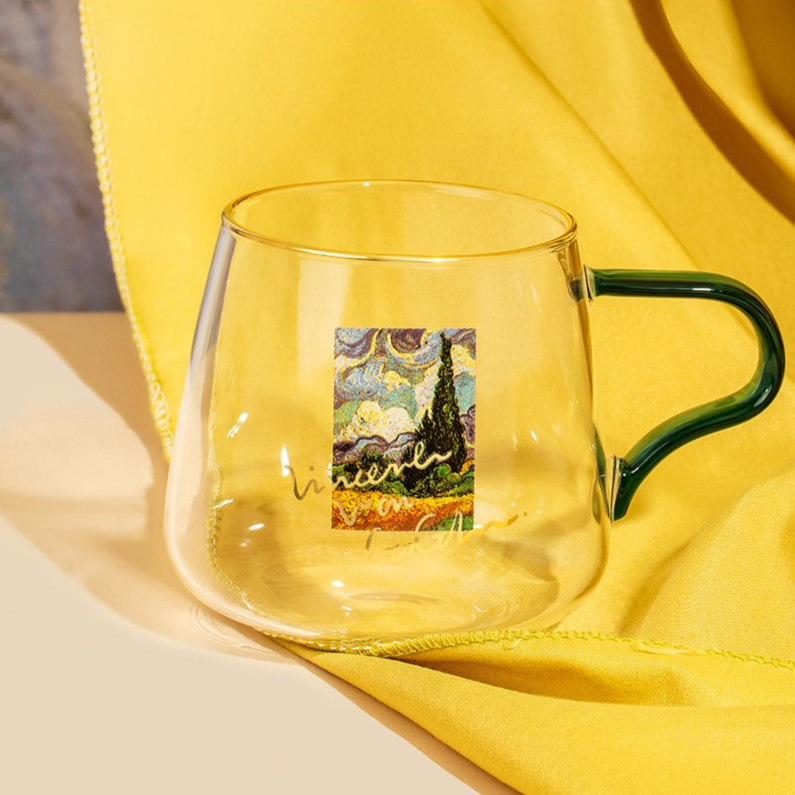rounded clear glass van gogh-design mug with green handle