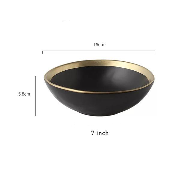 black bowl with gold rim